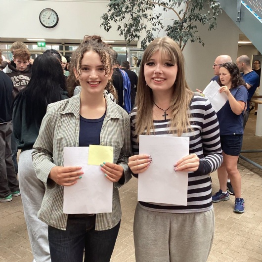 students smiling after getting their gcse results